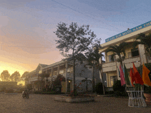 a building with a sign that says " vi loi ich muoi nam thi "