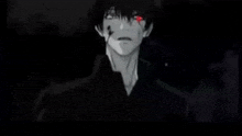 a black and white anime character with red eyes and a black shirt is standing in the dark .