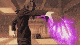 a man with long hair is holding a purple object