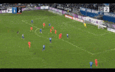 a soccer game is being played on a field with advertisements for nexen tire