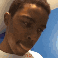 a close up of a person 's face with the word no on the bottom
