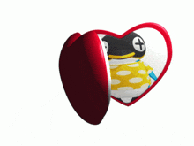 a heart shaped item with a picture of a penguin inside