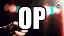 a person is holding a cell phone in front of a sign that says op