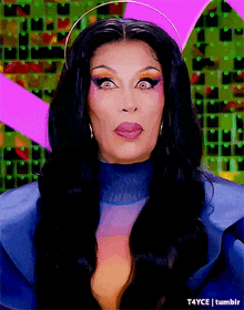 a close up of a woman 's face with a purple background