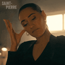 a close up of a woman 's face with saint-pierre written in the background
