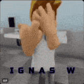 a gif of a person covering their face with their hands with the name ignas w written on the bottom