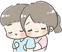 a boy and a girl are hugging each other .