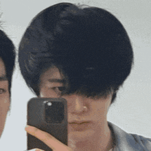 a man taking a selfie with a cell phone