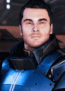 a close up of a man 's face in a blue suit