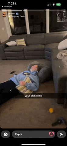 a screenshot of a snapchat of a person laying on the floor with the caption your shittin me