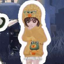 a girl wearing a yellow sweater and a duck hat
