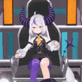a cartoon character with horns is sitting on a chair