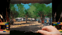 a person is painting a landscape with the words made in animatica on the bottom right
