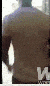 a blurred image of a man 's back with the word world on the bottom