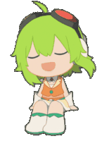 a girl with green hair is sitting down with her eyes closed and smiling