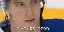a hockey player is wearing a helmet and glasses and says `` up yours , gerd '' .
