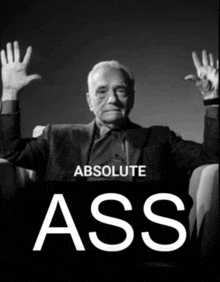 a black and white photo of a man with his hands in the air and the words " absolute ass "