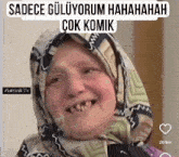 a woman with a scarf around her head is smiling with the words sadece guluyorum hahahahah çok komik written above her