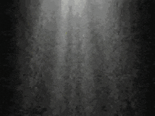 a light shines through a hole in the wall .