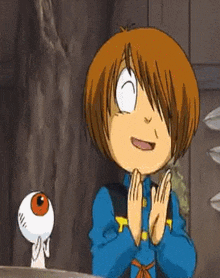a cartoon character with a big eye is standing next to a boy in a blue jacket .