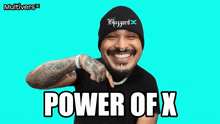a man wearing a beanie and a black shirt with the words power of x on it