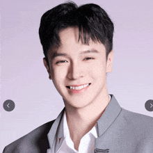 a close up of a young man 's face with a purple background