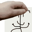 a person 's hand is holding a piece of paper with a drawing on it .