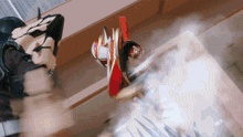 a person in a red and gold costume is being kicked in the face