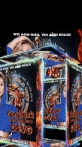 a woman in a blue shirt is on a box that says good luck greetings from dsvg