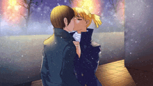 a man and a woman are kissing in a snowy scene