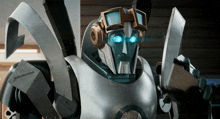 a robot wearing headphones and goggles has blue eyes