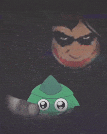 a cartoon of robin and the joker with a green object in front of them