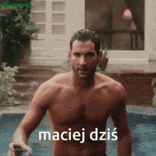 a shirtless man is standing next to a pool with the words maciej dzis written on the bottom