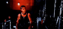 a man wearing a collar is standing in a dark room .