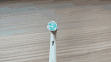a close up of an oral b electric toothbrush