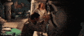 a man and a woman are standing next to each other in a dark room .. imgflip.com