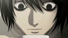 a close up of a person 's face with a cup in front of it