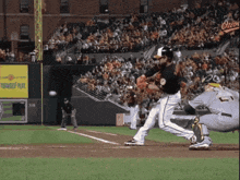 a baseball game is being played in front of a sign that says " yourself place "