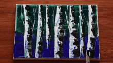 a painting of birch trees with blue and green paint