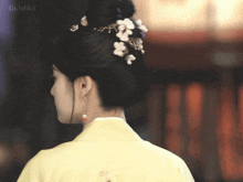 a picture of a woman 's back with gulubby written on the bottom right