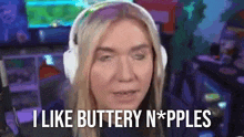 a woman wearing headphones says i like buttery n * pples