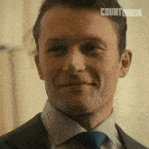 a close up of a man 's face with the word countdown on his head