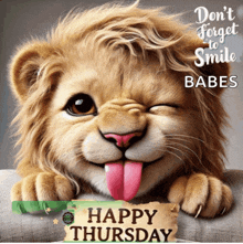 a picture of a lion with its tongue out and a happy thursday message