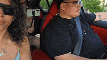 a man in a black shirt has a tattoo on his arm that says ' x '