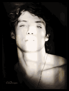 a black and white photo of a young man with the name cbd designs on the bottom right