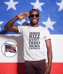 a man wearing a shirt that says skibidi rizz gyaft ohio sigma chungus salutes