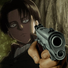a close up of a person holding a gun in front of a man in a suit .