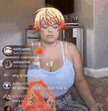 a woman with a wig on her head is sitting on the floor with a bag of chips in front of her .