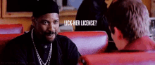 a man is talking to another man in a diner and the man is asking the man if he has a license