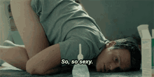 a man laying on the floor with the words so so sexy